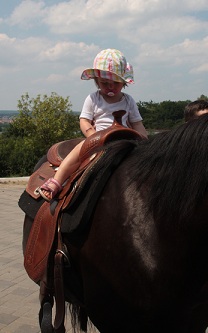 Bild Kind auf Pferd